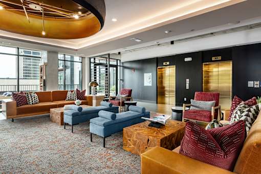 A living room with a large couch and a coffee table.