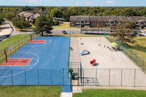 an aerial view of a basketball court at a city park