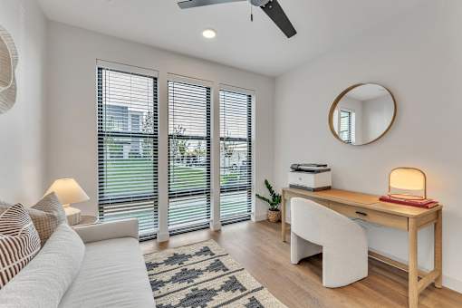 Room with desk and chair at Plaza at Pinnacle Hills, Rogers, AR, 72758
