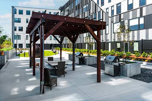 Steelcote Flats grilling stations and pergola with seating at Steelcote Square, St. Louis