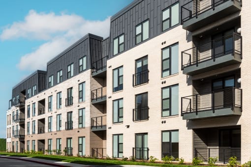 modern apartment buildings on a city street at The Flats & Terraces at Wildhorse Village, Missouri, 63005