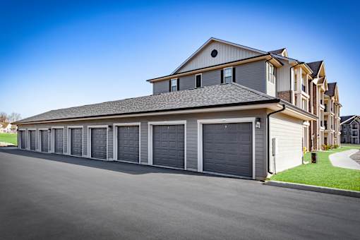 A large two-story house with a garage on the first floor.