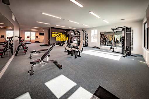 A gym with a sign that says "Don't excuse yourself".