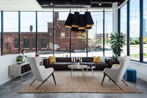 lobby with communal seating and stylish lighting at Steelcote Square, Missouri, 63103