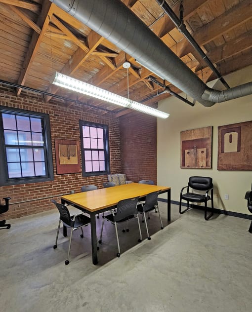 M Suites conference room with conference table and seating