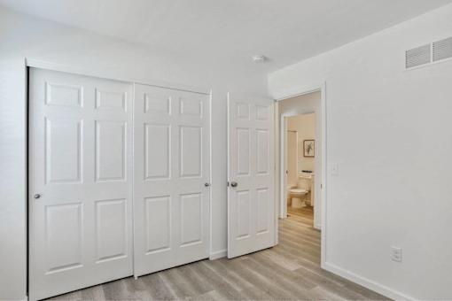 A white door with a white wall behind it.