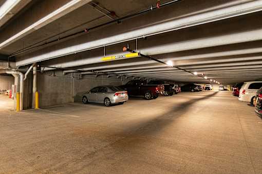 A parking garage with a sign at The Cunningham Apartments, Iowa, 50266