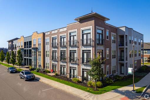 Modern apartment building with brick and contemporary facade at GrandView Flats and Townhomes Apartments, Granger, 46530
