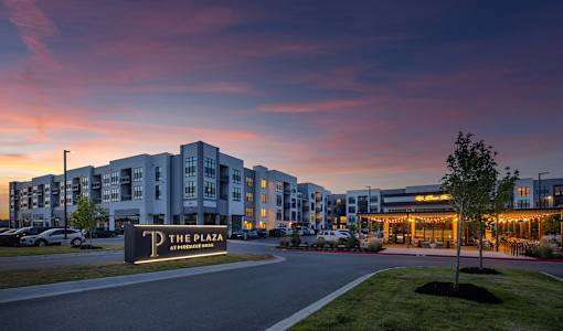 The Plaza is a modern apartment complex with a well-maintained outdoor area.