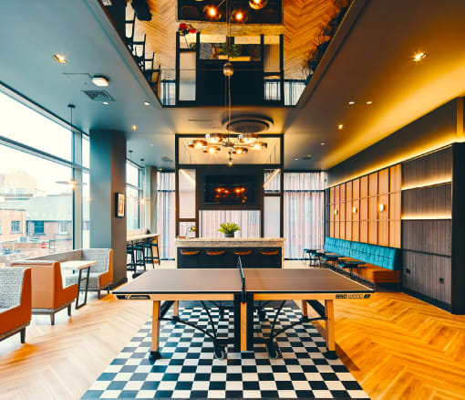 a ping pong table in the middle of a restaurant at The Rail, St. Louis, MO