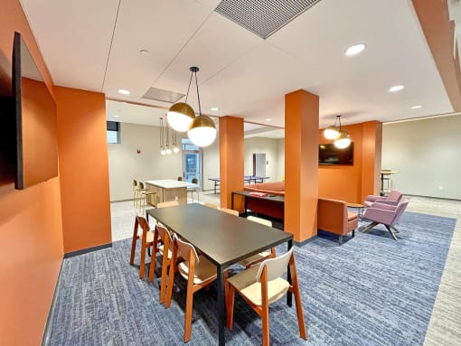 clubroom/resident lounge with large work table  at The Residences at Delmar DivINe, St Louis