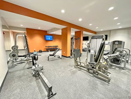 large fitness center with exercise equipment at The Residences at Delmar DivINe, St Louis, MO, 63112