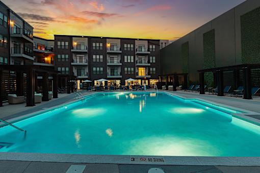 A pool with a sign at The Cunningham Apartments, Iowa, 50266