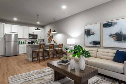 A modern kitchen with a dining table and chairs.