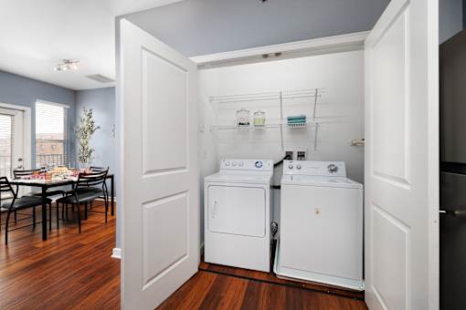 A laundry room with a washer and dryer in it.
