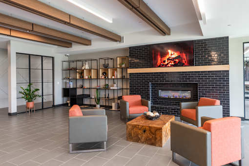 A modern living room with a fireplace and comfortable seating.