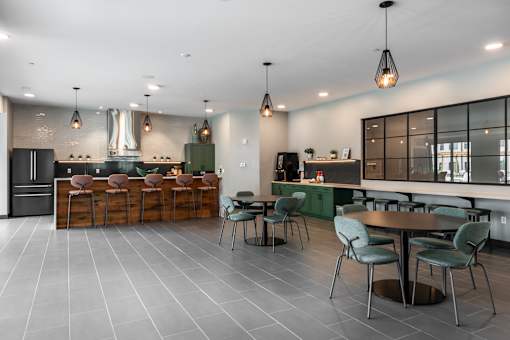 A modern kitchen with a dining table and chairs.