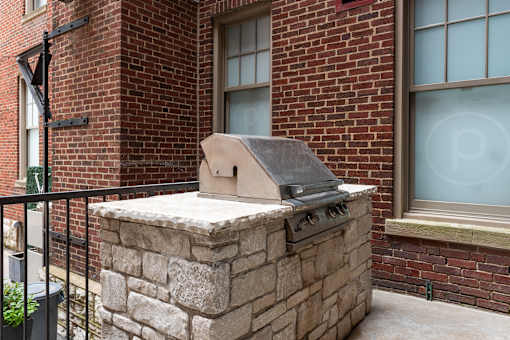 York House quaint courtyard with communal seating and grilling station