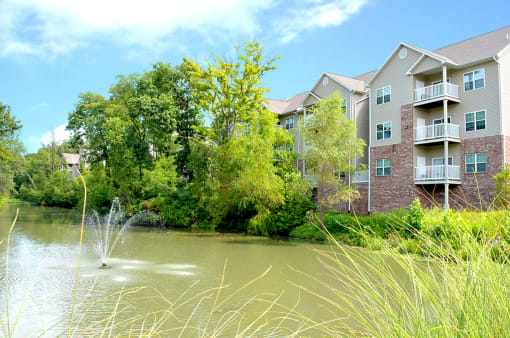 lake with fountain and buildings in distance at Villas At Crystal Lake, Swansea, IL, 62226