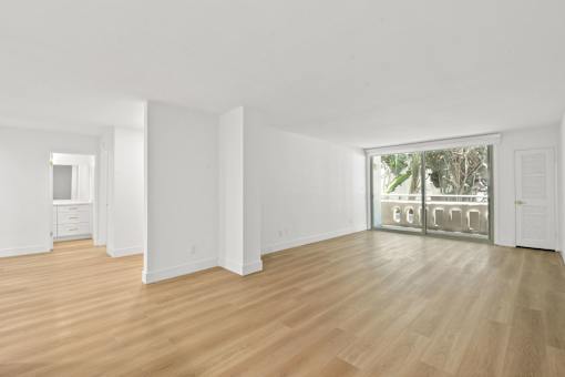 A room with wooden floors and white walls.
