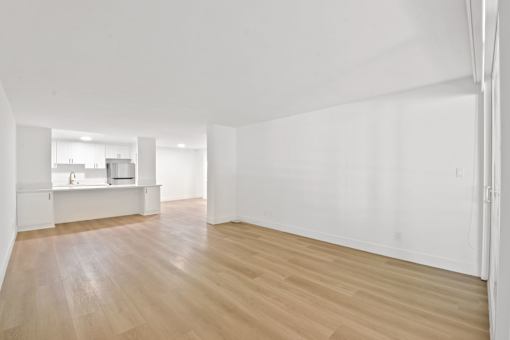 A room with wooden floors and white walls.