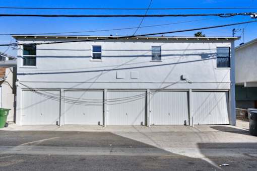 A white building with the letters "LL" on it.