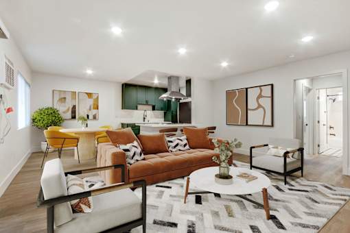 A living room with a brown sofa and a white coffee table.