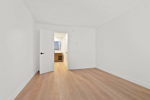 A long hallway with a door at the end.