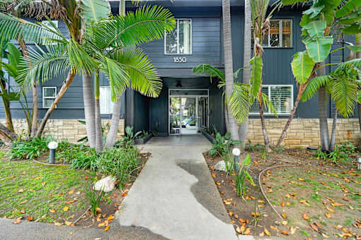A house numbered 1830 is shown with a pathway leading to the front door.