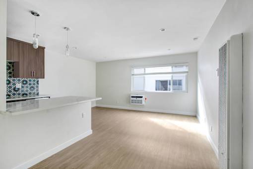 A room with a window and a counter.