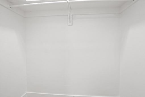 A white room with a white ceiling and a white wall.