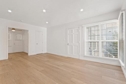 A room with wooden floors and white walls.