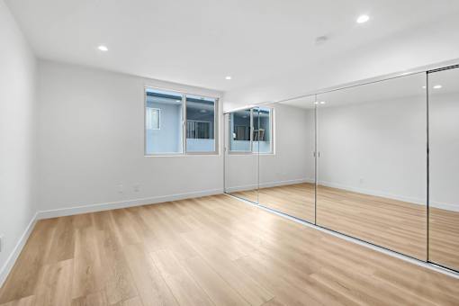 A room with wooden floors and a glass wall.