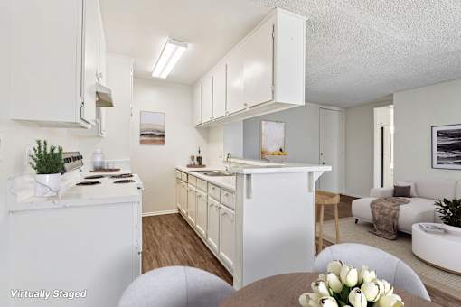 A white kitchen with ample storage space.