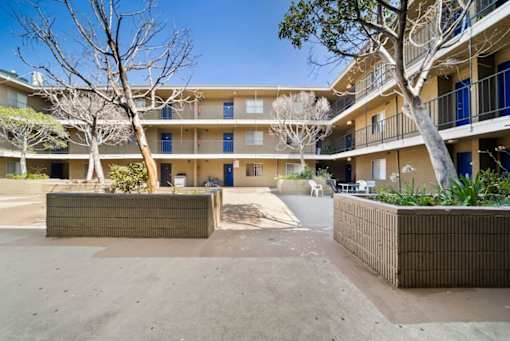 A sunny day at the courtyard of a residential building.