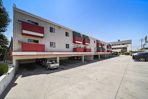 A large building with a red and white striped awning.