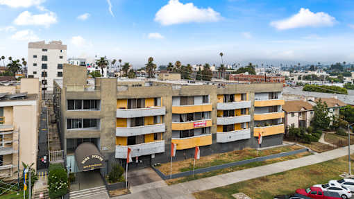 A large building with a yellow and white exterior.