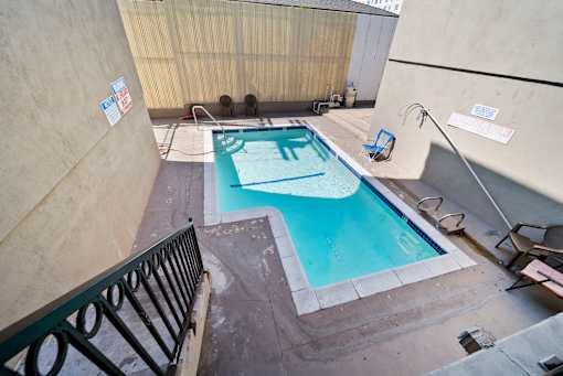 A small pool with a blue tinted water.