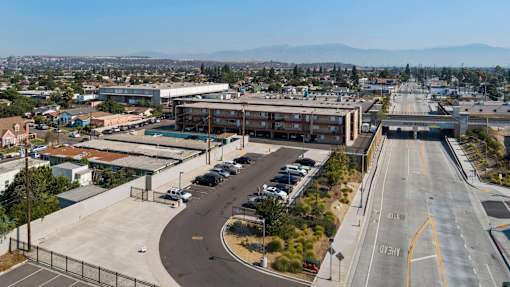 A highway interchange with a building in the background.