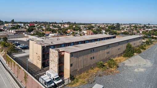 A large building with a truck parked in front of it.