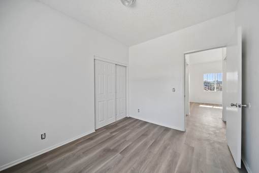 A room with a white door and a window.