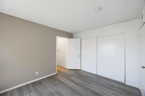 A room with a grey floor and white walls.