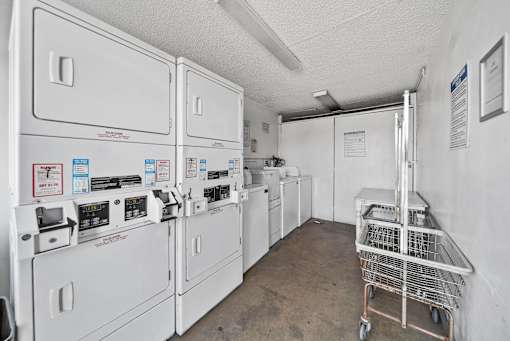 A laundry room with washers and dryers.