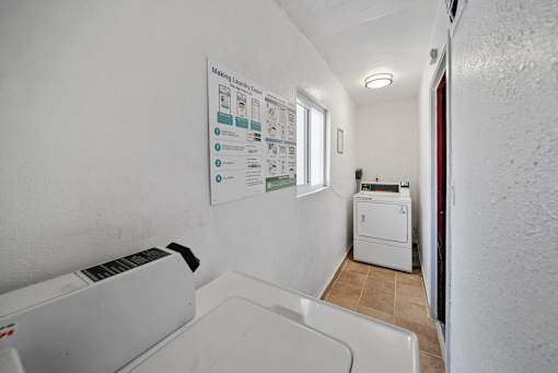 A white wall with a poster titled "Making Layers Fun" and a white washing machine.