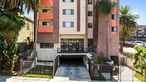 A building with a garage door open in front of it.