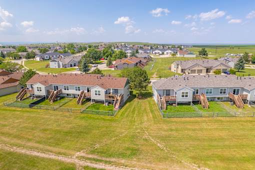 A bird's eye view of the residential area with houses and green lawns at Antelope Ridge.