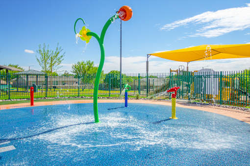 a water park with a yellow and red water slide
