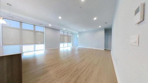 A room with wooden floors and white walls.