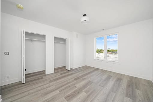 A room with a window and a door.