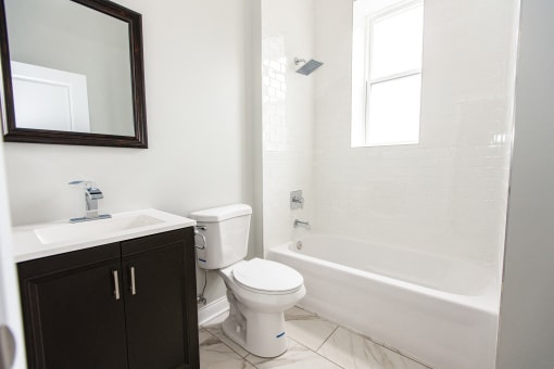 an empty bathroom with a toilet and a sink